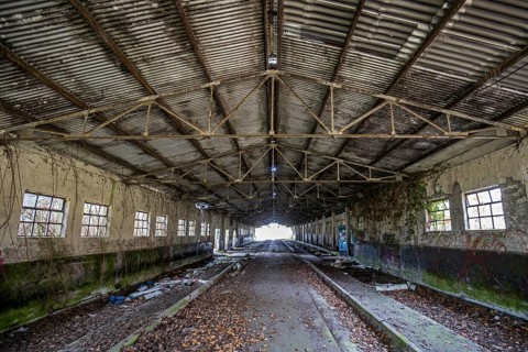 Abandoned hall with Grafity, dilapidated plant of a former agricultural production cooperative of