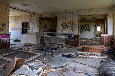 Abandoned room with old furniture and gravity in a building, dilapidated site of a former