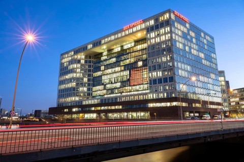 Mirror building on Ericusspitze Hamburg at blue hour with light strips and light trails from