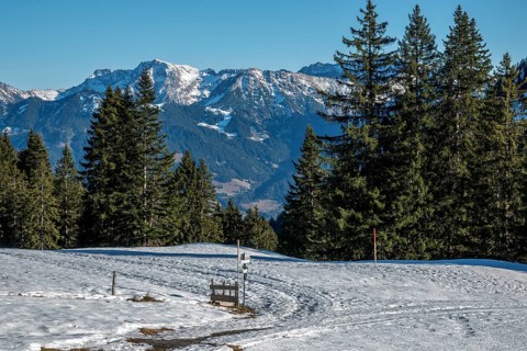 View from the high-altitude hiking trail from Bolsterlanger Horn to Riedberger Horn, snow-capped