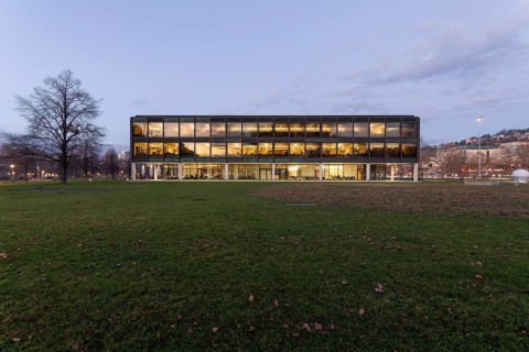 The state parliament of Stuttgart glows impressively in the evening. The architecture is