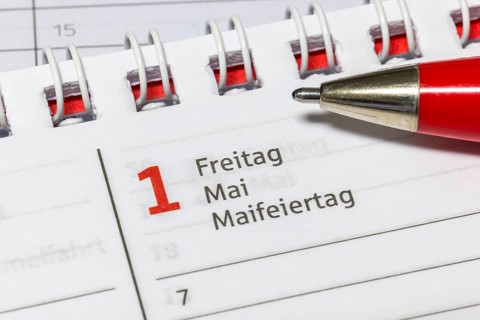 Calendar detail shows May 1, a Friday, highlighted as May Day, agenda
