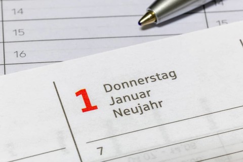 Calendar sheet with January 1, New Year, marked with ballpoint pen, diary