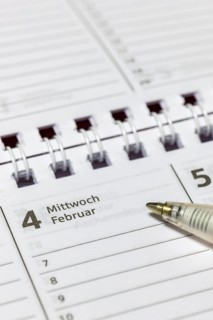 Calendar detail with ballpoint pen on a February-Wednesday page, appointment calendar