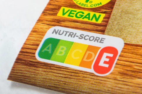 Food packaging with prominent Nutri-Score label and vegan sticker