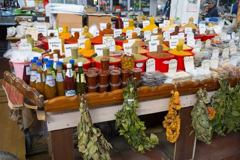 Market stand with a wide range of spices, herbs and pickled products, Akhaltsikhe market,