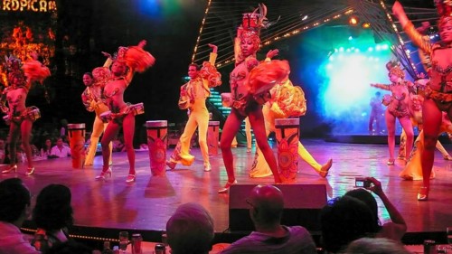 Revue dancers in opulent colorful costume and with feather headdress at Club Tropicana, Havana,
