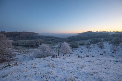 An impressive winter landscape on Randecker Maar near Ochsenwang, where a mystical sea of fog