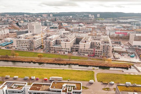 City with construction sites and river under cloudy sky, Neubau Krankenhaus, Böblingen, Germany
