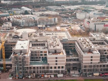 New hospital building with several buildings and cranes in an urban area, Böblingen, Germany