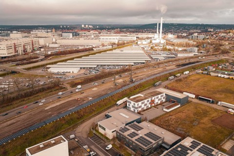 Industrial area with chimneys and factory buildings under a cloudy sky, A81, Böblingen, Germany