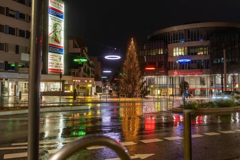Illuminated Christmas tree and colorful street lights in the city at night, Böblingen Christmas