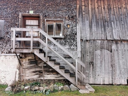 Detail of an old farmhouse in Schöllang, wooden staircase and entrance door, Illertal, Oberallgäu,