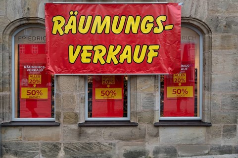 Posters for clearance sale at a shoe store, Lauf an der Pegnitz, Middle Franconia, Bavaria, Germany