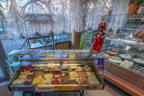 Showcases with homemade chocolates and cakes on the display case the trademark of the Sarotti