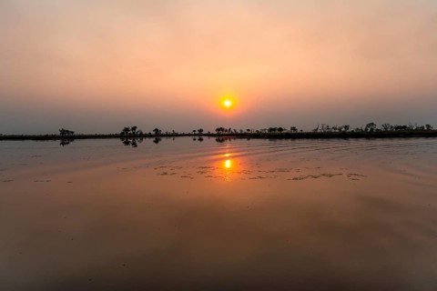 Lake at sunset, Xakanaxa Lagoon, Okavango Delta, Moremi Game Reserve, Botswana