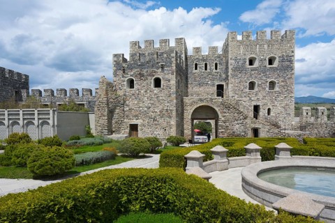Historic stone fortress with round tower, well-kept garden and round fountain, Rabati fortress,