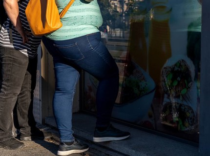 People with obesity stand at an ice cream parlour, Berlin, Germany