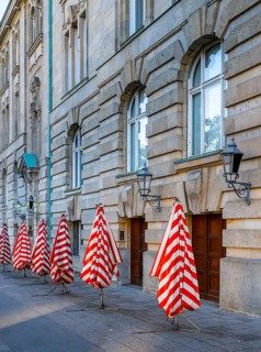 Red and white striped parasols on the back of the Deutsches Museum, Berlin, Germany