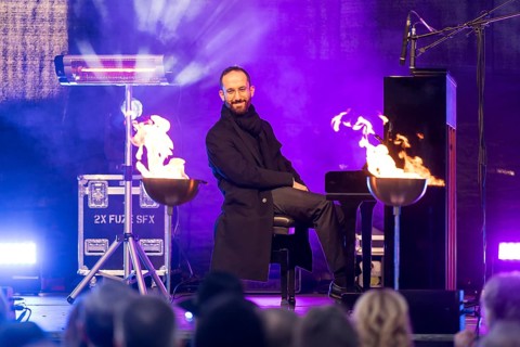 Igor Levit (pianist) plays the piano at the lighting of the 20th anniversary Hanukkah in front of