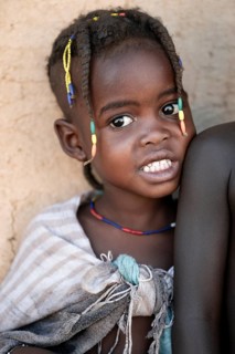 Portrait, brightly decorated girl of the Hakaona tribe, also Havakona or Hakawona, near Opuwo,
