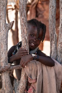 Portrait, young Himba child, traditional Himba village, Kaokoveld, Kunene, Namibia