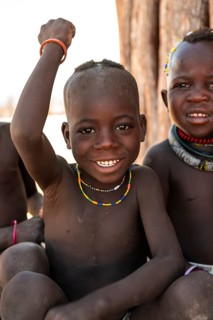 Portrait, funny Himba child, traditional Himba village, Kaokoveld, Kunene, Namibia