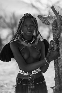 Black and white, young Himba woman with jewelry, portrait, traditional Himba village, Kaokoveld,