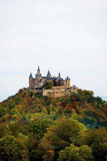 Castle and autumnal forest, Hohenzollern Castle, Hechingen, Swabian Jura, Baden-Württemberg,