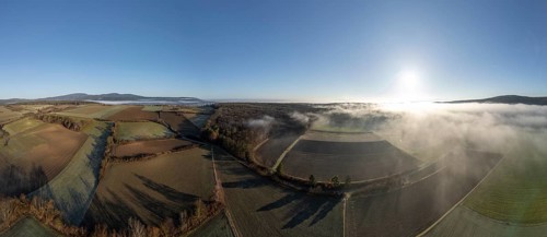 Aerial view of fog over fields and forest, St.Veit, Berndorf, Lower Austria, Austria