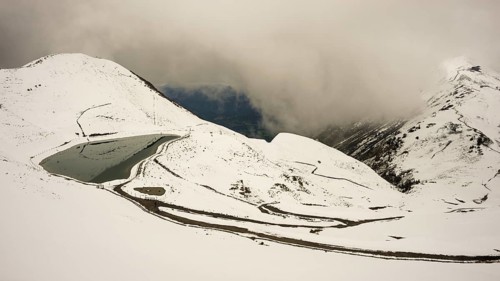 Another onset of winter in May, Riezler Alpsee, an artificially created lake, snow pond, feeds the