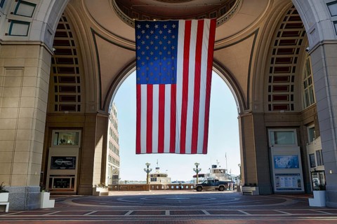 American flag fluttering, distinctive archway, Boston Harbor Hotel, Rowes Wharf, Freedom Trail,