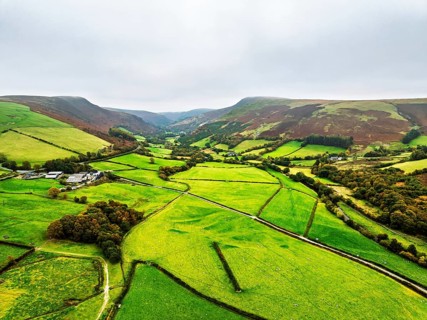 Autumn colours of Farms over River Wye and Road A470 from a drone, Llanidloes, Powys,