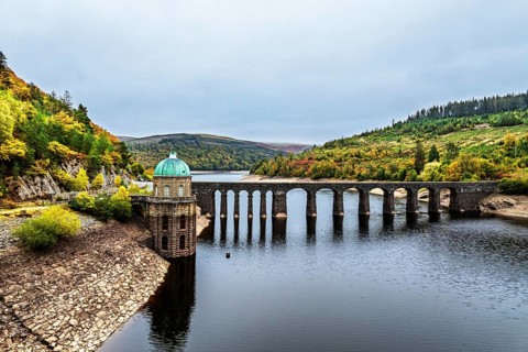 Autumn over Garreg Ddu Dam from a drone, Elan Valley, Caban-Coch Reservoir, Rhayader, Wales, UK