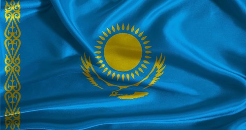 Kazakhstan flag with cloth textured background. National flag of Kazakhstan with realistic texture