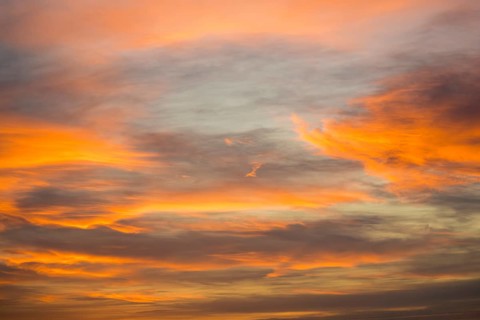 Softly colored clouds fill the sky in warm tones at sunset, Baden-Württemberg, Germany