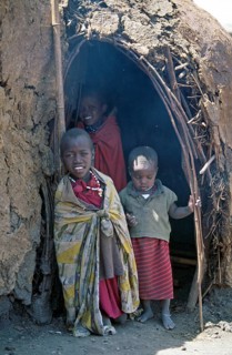 Maasai children in front of a hut in their village in the Ngorongoro Crater, Tanzania, June 2000,