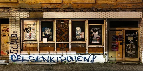 Decaying façade covered with graffiti, no-go area in Gelsenkirchen, one of the poorest cities in