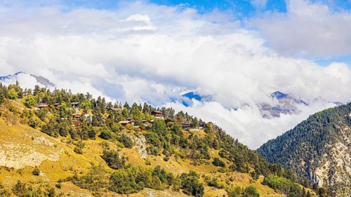 Rising fog over the mountain village of Vercorin, Val d'Anniviers, Valais Alps, Canton of Valais,