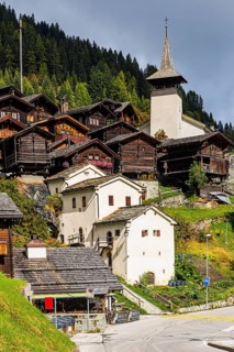 White cellars, historic farmhouses, Saint Theodule church, Grimentz, Val d'Anniviers, Valais Alps,