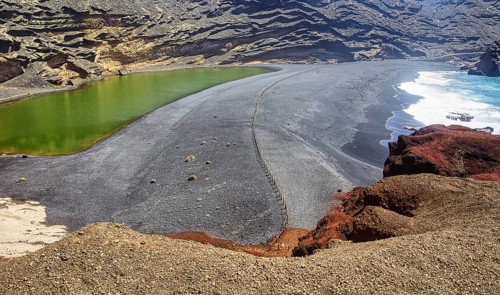 Volcanic landscape with green lagoon and rugged coastline, El Golfo Lanzarote, Canary Island