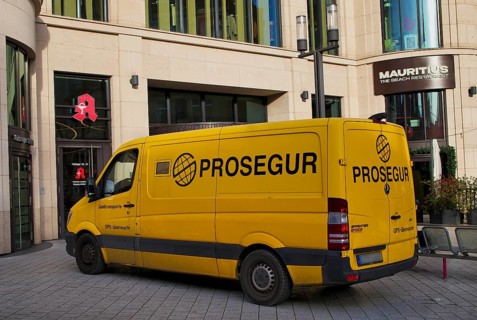 Exterior view of yellow Prosegur cash transporter, security service, logo, parked in front of Das