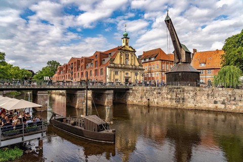 Old harbour with crane and hotel department store in the Hanseatic city of Lüneburg, Lower Saxony,