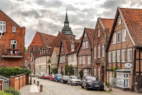 Half-timbered houses in the historic street Auf dem Meere and the St. Michaelis church in the