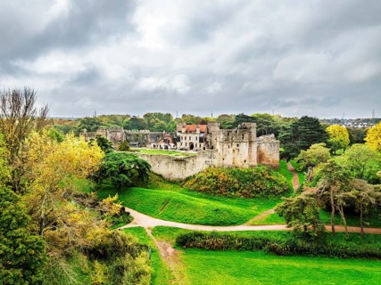 Autumn Colours over ruins of Caldicot Castle from a drone, Caldicot, Monmouthshire, Wales, UK