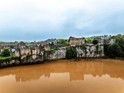 Autumn over Chepstow Castle and River Wye from a drone, Chepstow, Monmouthshire, Wales, UK
