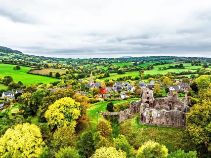 Autumn Colours over ruins of Grosmont Castle from a drone, Grosmont, Monmouthshire, Wales, UK