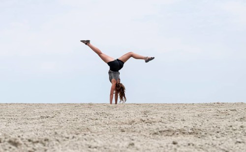 Abstract, woman doing gymnastics in a whirring landscape, Etosha pan, Etosha National Park, Namibia