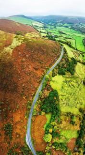 Autumn colours of Farms over River Wye and Road A470 from a drone, Llanidloes, Powys,