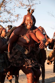 Himba woman dancing euphorically, traditional dance, traditional Himba village, Kaokoveld, Kunene,